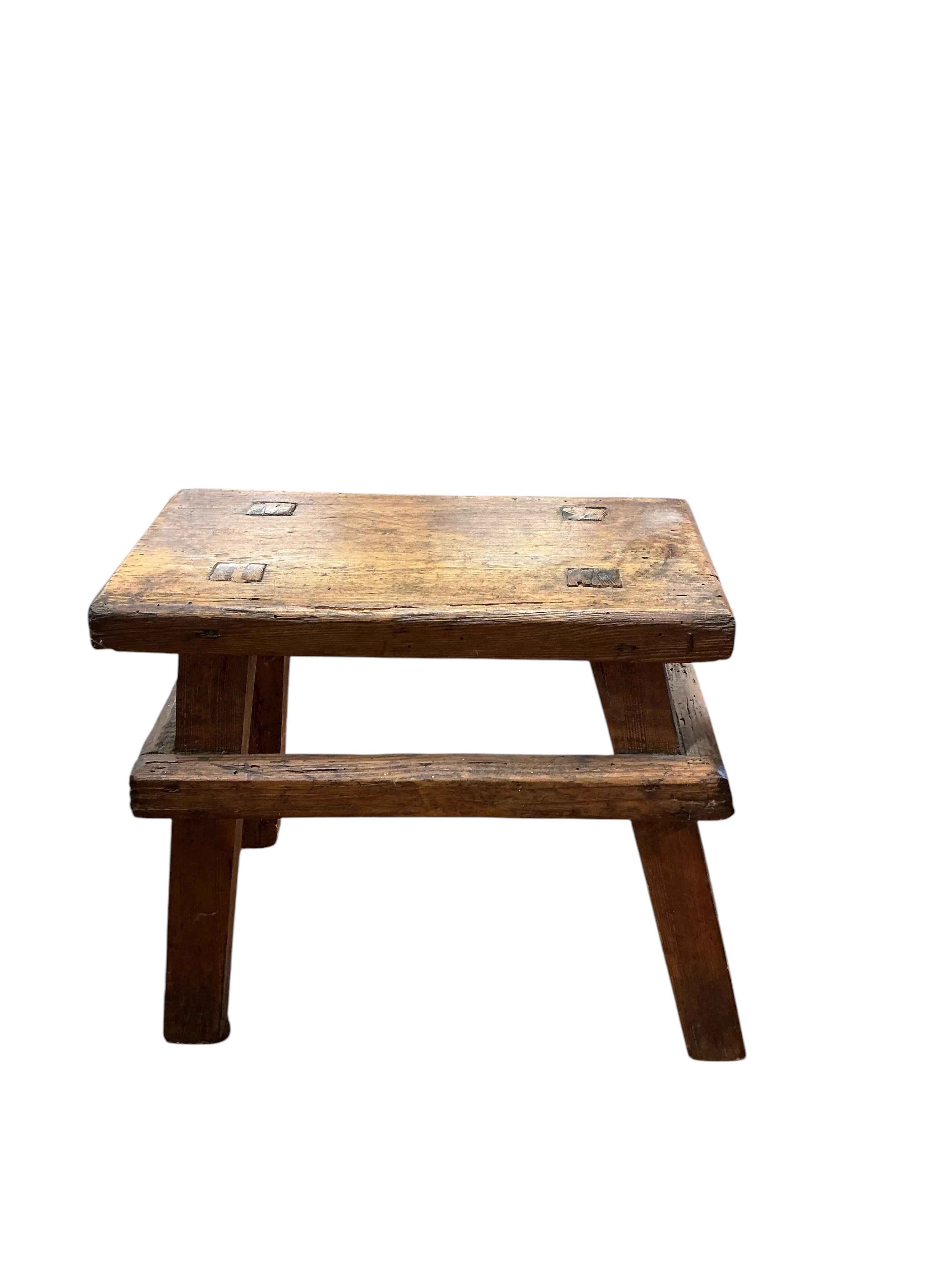 A small Victorian rectangular pine trunk, width 49cm, depth 29cm, height 22cm, together with two Provincial stools, a staved bucket and a measure